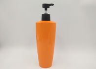 Le bottiglie di plastica del cosmetico dell'ANIMALE DOMESTICO arancio ovale svuotano la superficie di lucentezza della bottiglia del sapone della lozione