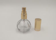 Bottiglia di vetro dello spruzzo del profumo dorato della pompa rotonda con la stampa su misura del logos